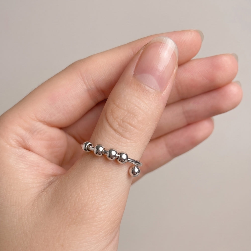bague-anti-stress-tournante-a-perles-ajustable-ouverte-argent-pouce
