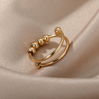 bague-anti-stress-tournante-a-perles-ajustable-ouverte-or-cote
