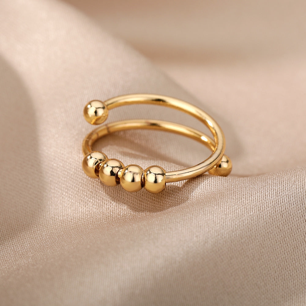 bague-anti-stress-tournante-a-perles-ajustable-ouverte-or-situation